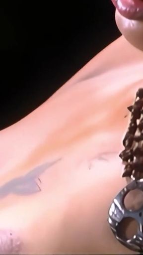 Key moment from "Excited lesbian teens experiment with anal sex toys on each other at the beach"