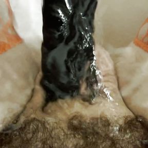 Washing my cock out with a black dildo