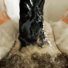 Washing my cock out with a black dildo