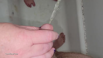 PIss play in the shower in slow motion