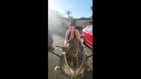 Hot Trashy MILF in tiny shorts parades for the camera on motorbike