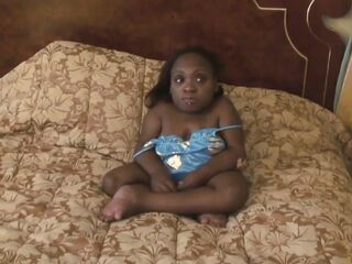 Black midget gets sprayed on her abdomen