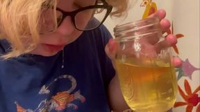 trans boy pisses in a cup and spits it out