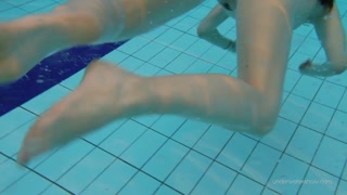 Red swimsuit beauty Katy with bushy pussy underwater