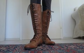 Brown lace-up boots show