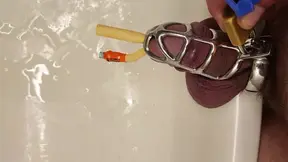 Pissing with catheter locked in chastity cage