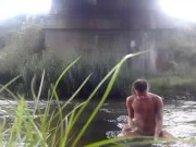 Tarzan bathing in a river naked