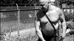 Big belly gay bear step daddy hunk muscle bear working in the garden. Film muscle gay hairy bodybuilder