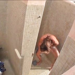 Hot brunette pisses in the shower