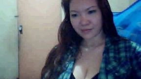 Flabby tits of a mature brunette Asian lady on webcam