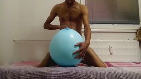 Intimate play with a big blue balloon