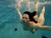 Brunette big tits teen Andrea swimming in the pool