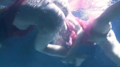 Russian lesbian girls swimming in the pool