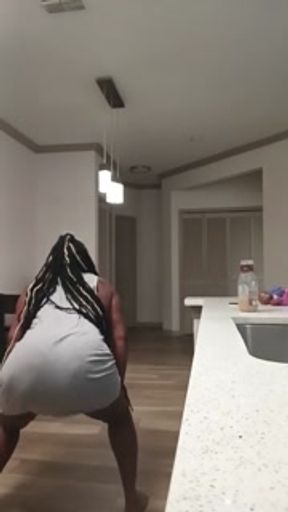His wife in the kitchen twerking