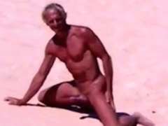 Tanned guy on beach in tiny string thong (temporarily!)