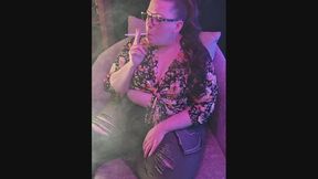 Sitting on my chaise in a flowered blouse and fashionably ripped jeans smoking a VS 120