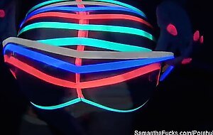 Colorful blacklight teasing with Samantha Saint