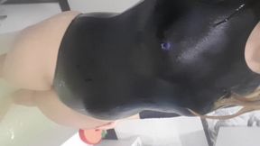 I'm wet in a latex bathing suit and I am taking a shower