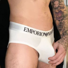 Tattooed stud oiling up monster cock through underwear