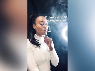 TRICKLED: Hot smokin' model Black Foxx sensually smokin' an all white cigarette