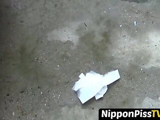 Perverted Asian teen wipes her cunt after taking a piss in public