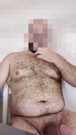 Horny bear cub jerks off thick uncut cock and shoots a huge load