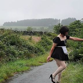 Crossdressing slut Maid on a public lane in the rain