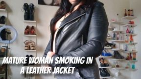 Mature woman smoking in a leather jacket