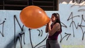 Laura Blows to Pop an Orange 17-Inch Tuf-Tex