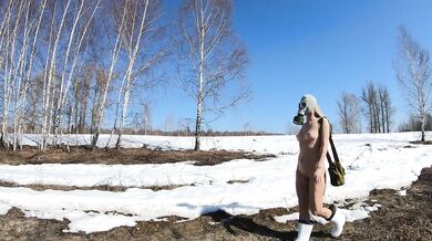 Nude girl in a gas mask