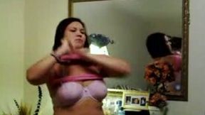 Chubby Latina chick flashees her boobies while changin