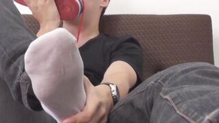 jock with a handsome foot fetish stroking and licking his feet