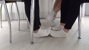 THREE PAIRS OF WHITE SOCKS UNDER THE TABLE