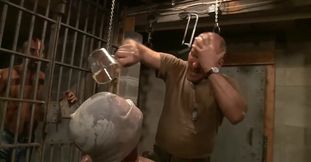 Tall man is in prison and he seems to be on a mission