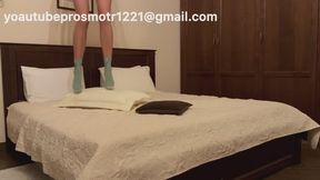 Nastya checked into a new hotel with a large bed and immediately decided to test it out. She tramples, jumps, in socks, barefoot, and in high heels, very hard, and also tramples pillows and sits on them with her ass. + humping
