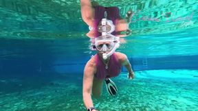 Carissa in the pink suit snorkeling in the springs and topless