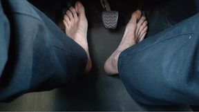 Riding a car, pedal pumping barefoot - soles above the hard pedals (avi)