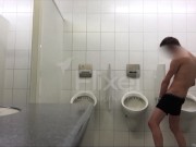 Exhibitionist boy is pissing in a urinoir - long gif video