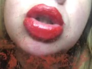 Red lips kissing glass