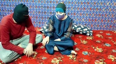 Young Pakistani brunette yields to her Arab cousin in a satin-draped bedroom