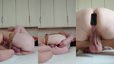 Feinstrumpfhose und der Analplug im Bett 1