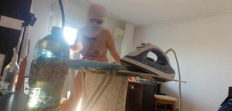 Amateur wife doing housework naked. Sexy and naughty wife trying on clothes that she cuts.