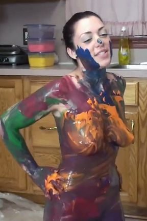 Melina Mason is playing in paint