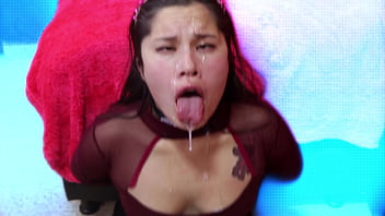 Asian slut plays with cum in mouth