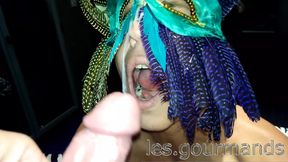 MILF with feathered mask sucks and takes HUGE cumshot on face
