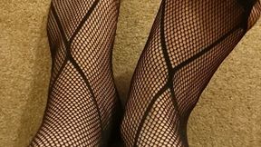 Feet in fishnet stockings