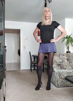 Crossdresser Sissy in Mini-Skirt and high heels