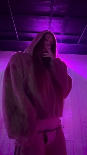 Smoking a Cigarette Outdoor While Wearing Only a Bikini and a Jacket