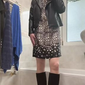 In high heels, leather jacket and dress