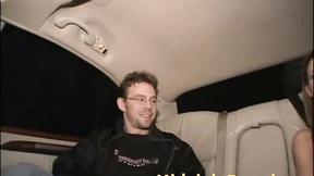 ”Two Brunette Car Ride showing tits in fishnet clothes”